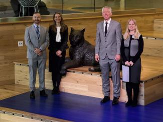 University of Kentucky Endowment Team Picture next to Bowman in Student Center