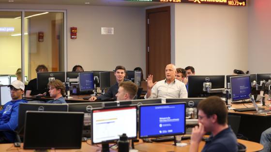 Instructor teaching alongside students